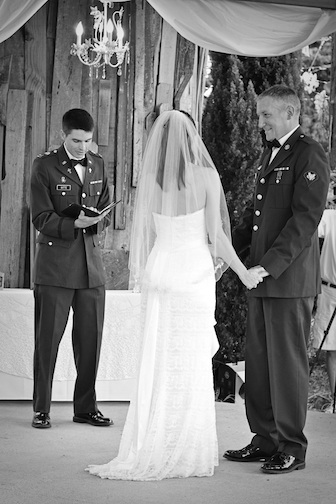Amy and Andy Cains exchange vows July 4, 2012, under the Bernice Garden pergola, with Andy's Army National Guard chaplain, Captain David Witte, as officiant. Photo by Kaysi Jacks (with permission)