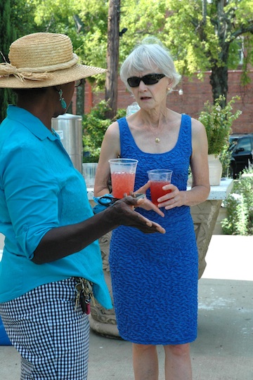 Jean Hine, a 3-year Master Gardener who volunteers at the Scholar's Garden Project at the Clinton School of Public Service, visits with TBG's Laverne Davis.